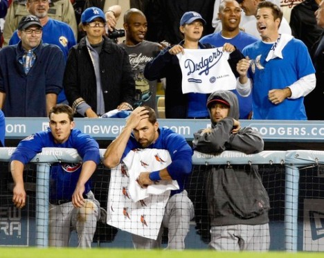 "As Dodgers fans celebrate above the Cubs dugout, Ryan Theriot, Mark DeRosa and Ted Lilly can only watch the end of the 3-1 loss."